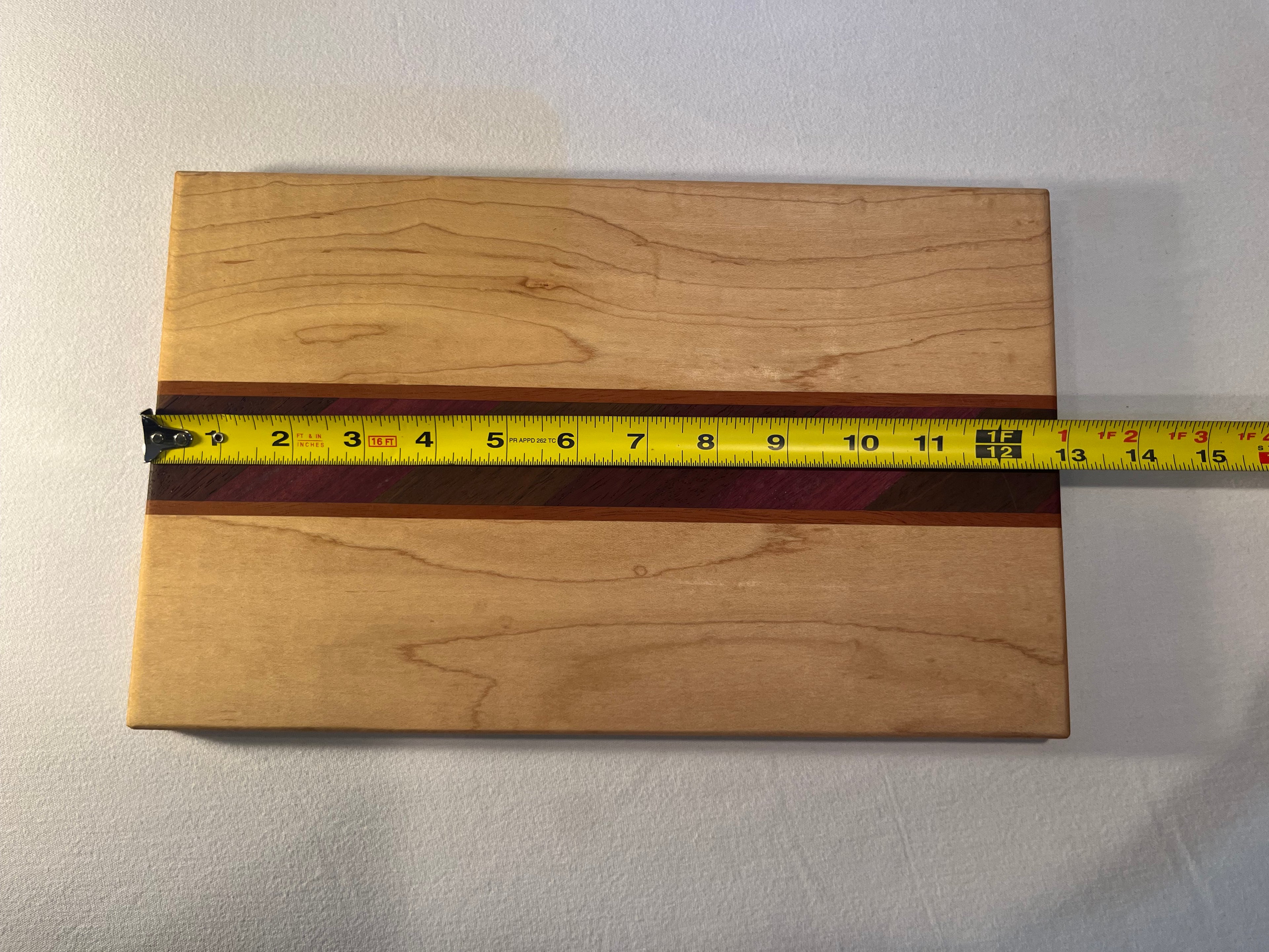 Maple cutting board with exotic inlay