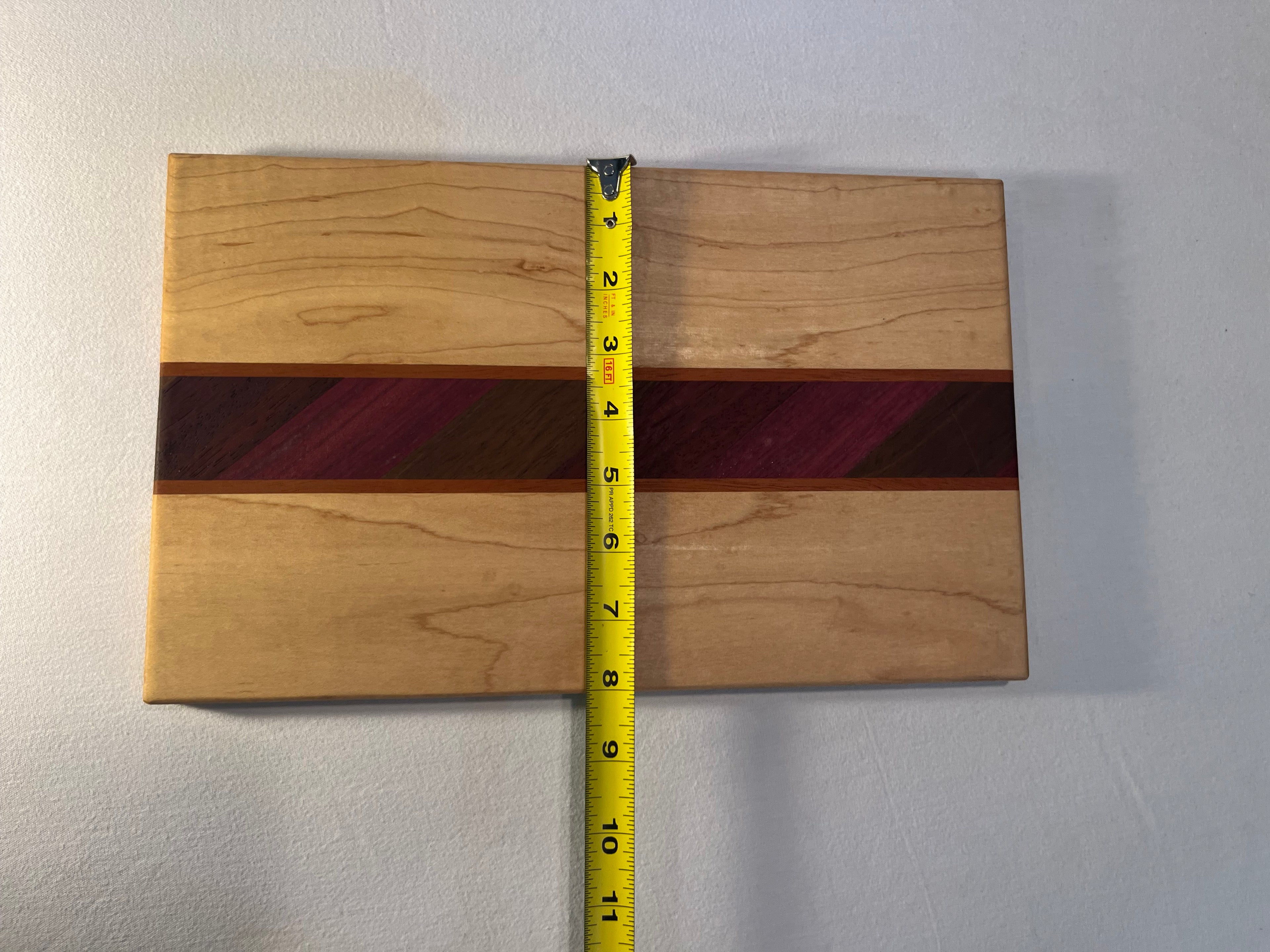 Maple cutting board with exotic inlay