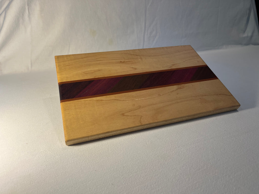 Maple cutting board with exotic inlay